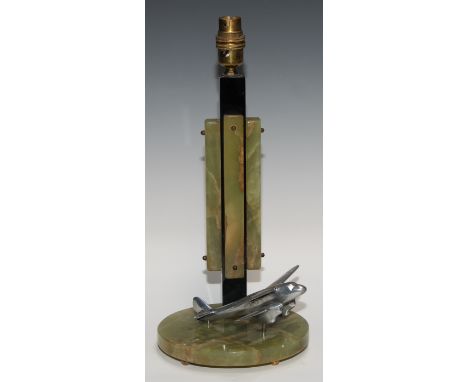 An Art Deco onyx and black marble table lamp, of geometric composition, the circular base mounted with a cast alloy model of 