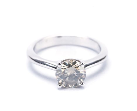 A SOLITAIRE DIAMOND RING centered with a round brilliant-cut diamond weighing 1.59cts, impressed 750, size N.The diamond acco