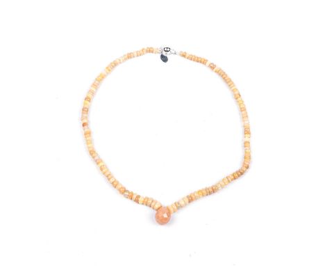 AN OPAL BEAD NECKLACE composed of a single strand of opal beads, weighing approximately 78cts in total, suspending a pear-sha