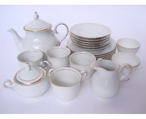 A Czech Moritz Zdekauer porcelain part tea service comprising teapot, twin handled sugar bowl and cover, milk jug, four teacu