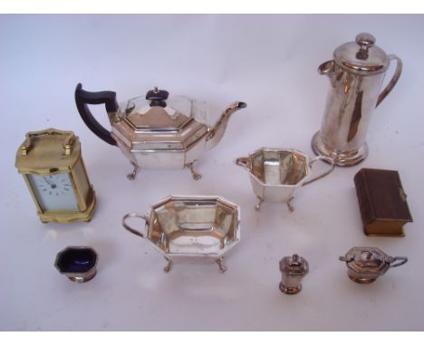 Silver plate tea pot/ coffee pot etc, a battery operated brass carriage clock, a leather bound book of common prayer (9). 