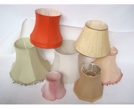 Twenty mostly silk lamp shades for table, standard and wall lights. 