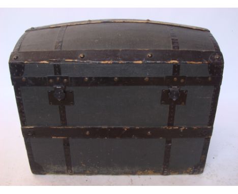 A late 19th Century/early 20th Century canvas wooden bound domed trunk. 
