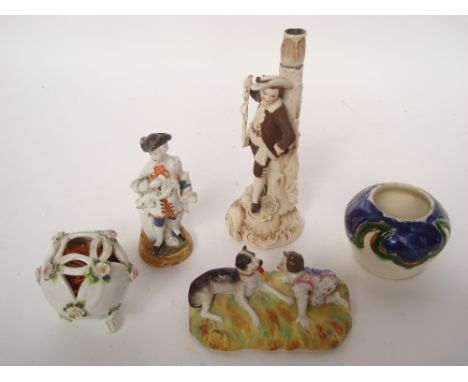 A 19th Century Continental porcelain ornament of a recumbent hound and a child on all fours (small chip to dog), a porcelain 