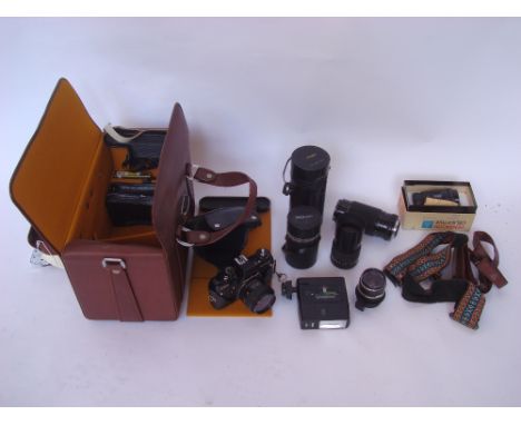Praktica B200 single lens reflex camera, lenses, light meter etc in travel case.