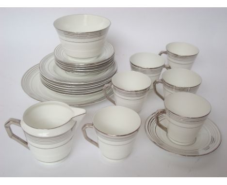 An Art Deco C.W.S Windsor China six setting tea service, decorated with silver lustre bands. 