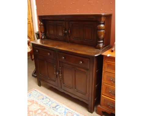 An Ercol elm court cupboard. 