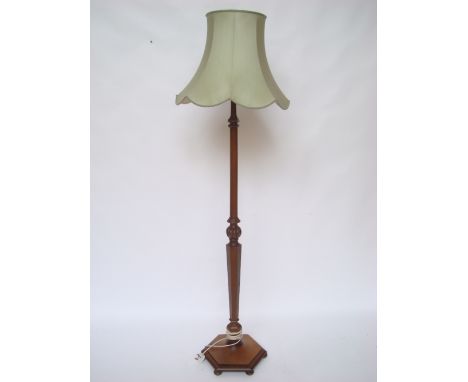 A mahogany standard lamp. 