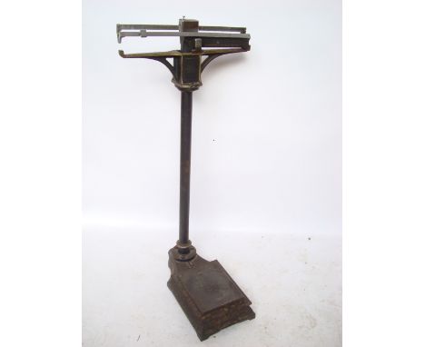 A late Victorian / Edwardian Allen & Hanburys painted cast iron platform weighing scales. 