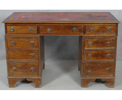 A 19th century mahogany three section pedestal desk with inset leather top resting on bracket feet. H.75 L.121 W.61.5cm 