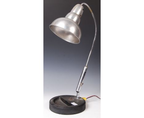 A stunning early 20th century vintage industrial desk lamp having a stepped conical shade with ball joint and sweeping arm le
