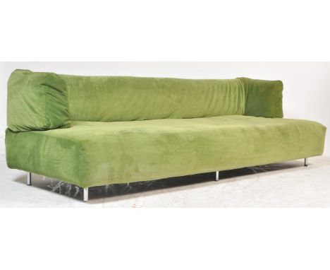 A 1970's Italian retro vintage designer Lignet Roset style large sofa having a wide deep cushioned seat and backrest with fol