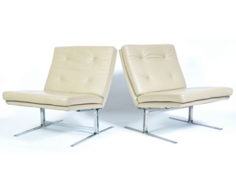 A pair of 20th century retro vintage easy / lounge chairs comprising of a chrome plated steel frame with supporting a cushion