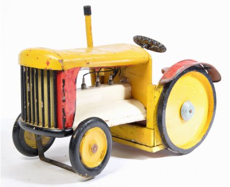 A 20th century retro vintage scratch built stationary children's tractor removed from a fairground and constructed from wood 