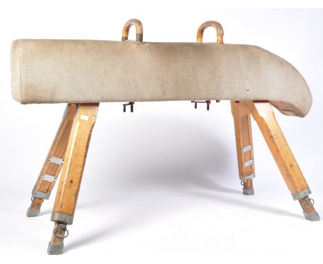 A 20th century retro vintage pommel horse / gymnastic vault bench raised on adjustable squared legs with stunning long and di