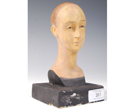 A 20th century retro vintage miniature art sculpture of an&nbsp;androgynous figure bust set to an ebonised plinth, the stylis