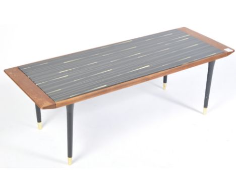 A 20th century retro vintage teak wood coffee / centre table having a glass top with backgammon design in black and white, al