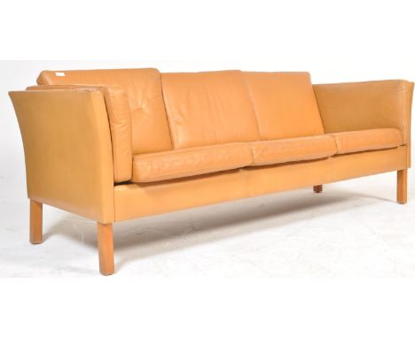 A retro vintage 1970's Danish tan leather three-seater London style sofa / settee. Light-tan leather upholstery, with flared 