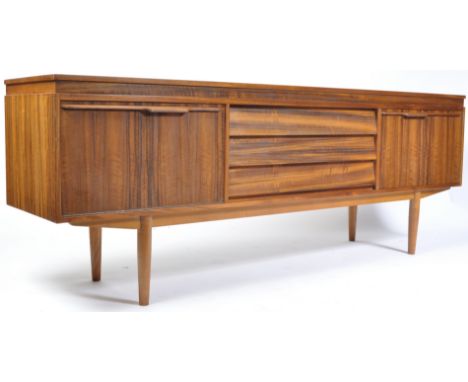 Neil Morris - Morris Of Glasgow - A mid 20th century retro vintage black walnut sideboard credenza having an arrangement of t