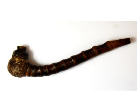 An early 20th Century Chinese opium pipe, L. 17cm.