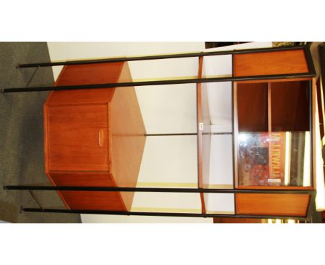 A 1970's teak ladder rack corner cabinet, H. 181cm, W. 90cm.