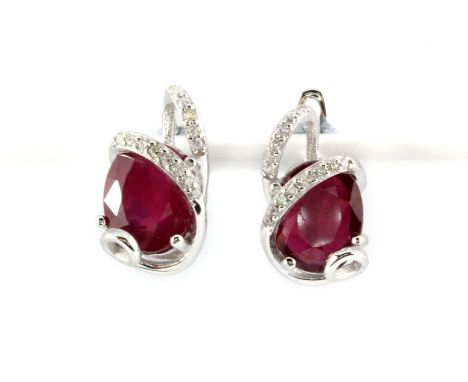 A pair of 925 silver earrings set with oval cut rubies and white stones, L. 1.7cm.