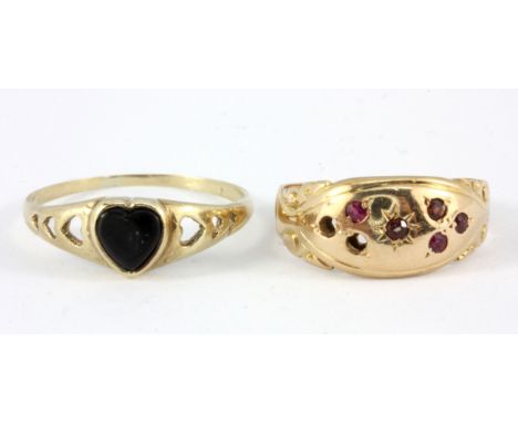 A yellow metal (tested minimum 9ct gold) onyx set ring, and an 18ct gold ruby set ring (two stones missing), (M & I).