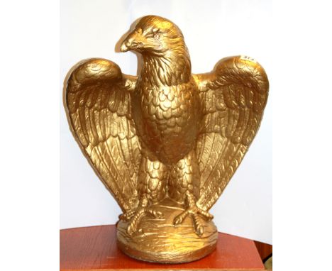 A large gold painted concrete eagle, H. 58cm.