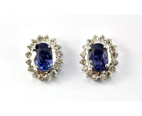 A pair of 18ct white gold (stamped 750) sapphire and diamond set cluster earrings, approx. 3.04ct sapphires and 0.90ct diamon