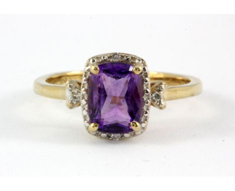 A 9ct yellow gold amethyst and diamond set cluster ring, (M.5).