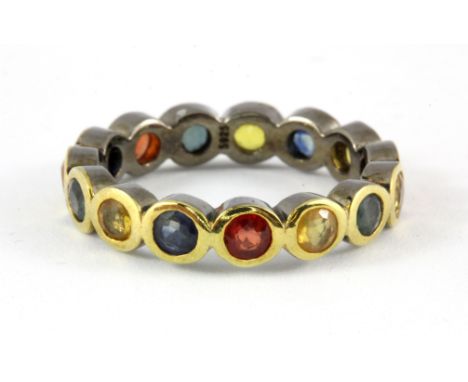 A 925 silver gilt full eternity ring set with mixed fancy colour sapphires, (L).