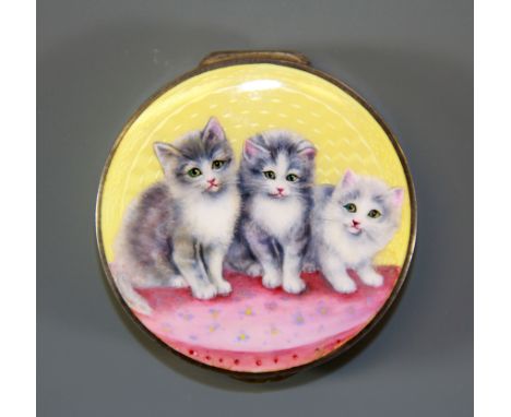 A 1930's hand enamelled and engine turned white metal (tested silver) compact decorated with kittens, Dia. 5.5cm.