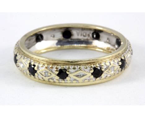 A 9ct yellow and white gold sapphire and diamond set full eternity ring, (O).