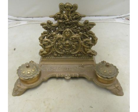 A pair brass candlesticks and brass inkwell and magnifier