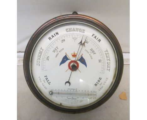 A Royal Navy barograph and a circular wall clock