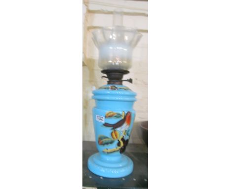 A pretty Victorian blue glass oil lamp with vaseline shade
