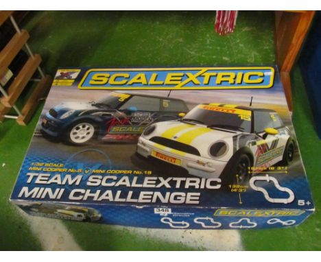 A Scalextric box set 1:32 scale Mini Cooper No.5 v Mini Cooper No.15