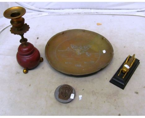 A brass dish, grasshopper, candlestick and plaque