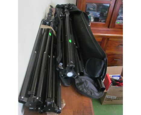 A Calumet large photography light stand and two tripods