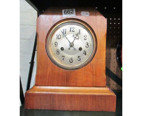 A walnut case mantel clock