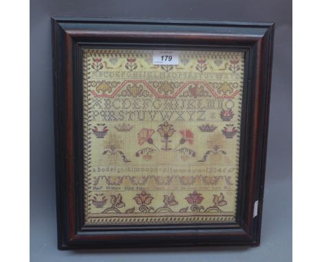 A Victorian 1812 sampler framed and glazed. 33cm x 36cm