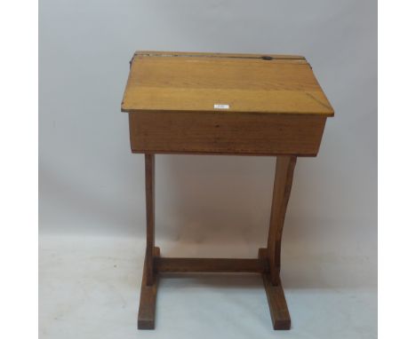 A vintage oak school desk. H-80cm, W-58cm, D-47cm 