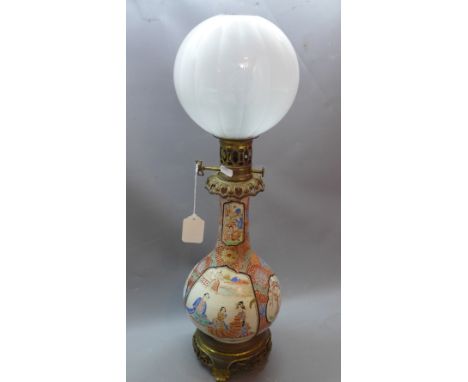 A 19th Century Japanese baluster vase converted into an oil lamp on gilt metal base with globular opaque glass shade. H-62cm 