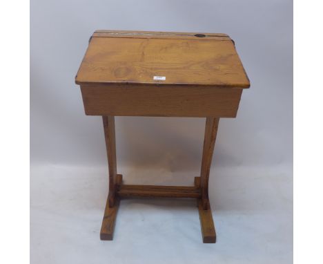 A vintage oak school desk. H-80cm, W-58cm, D-47cm 