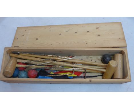 A vintage croquet set in pine case