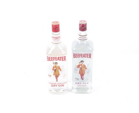 Two bottles of Beefeater gin. one bottle contains 1l, 40% vol, the second 1.14l, 47% vol.