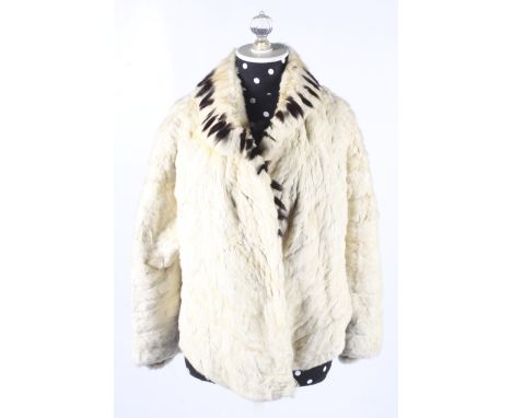 A vintage ermine fur jacket. Three-quarter length sleeves, lined in cream silk, L62cm x shoulder W49cm Condition Report: Heav