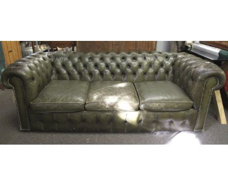 A contemporary green leather buttoned back chesterfield three seater sofa. With studded front arms. L200cm x D88cm x H68cm