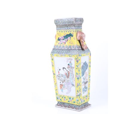 A 19th/early 20th century Chinese famille jaune vase. Of rectangular form, with a Fo dog and possibly a xiezhi between two el