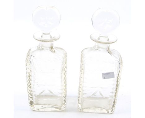 A pair of Georgian decanters. Of rectangular form, with cut glass decoration and shaped stoppers, H25cm Condition Report: One